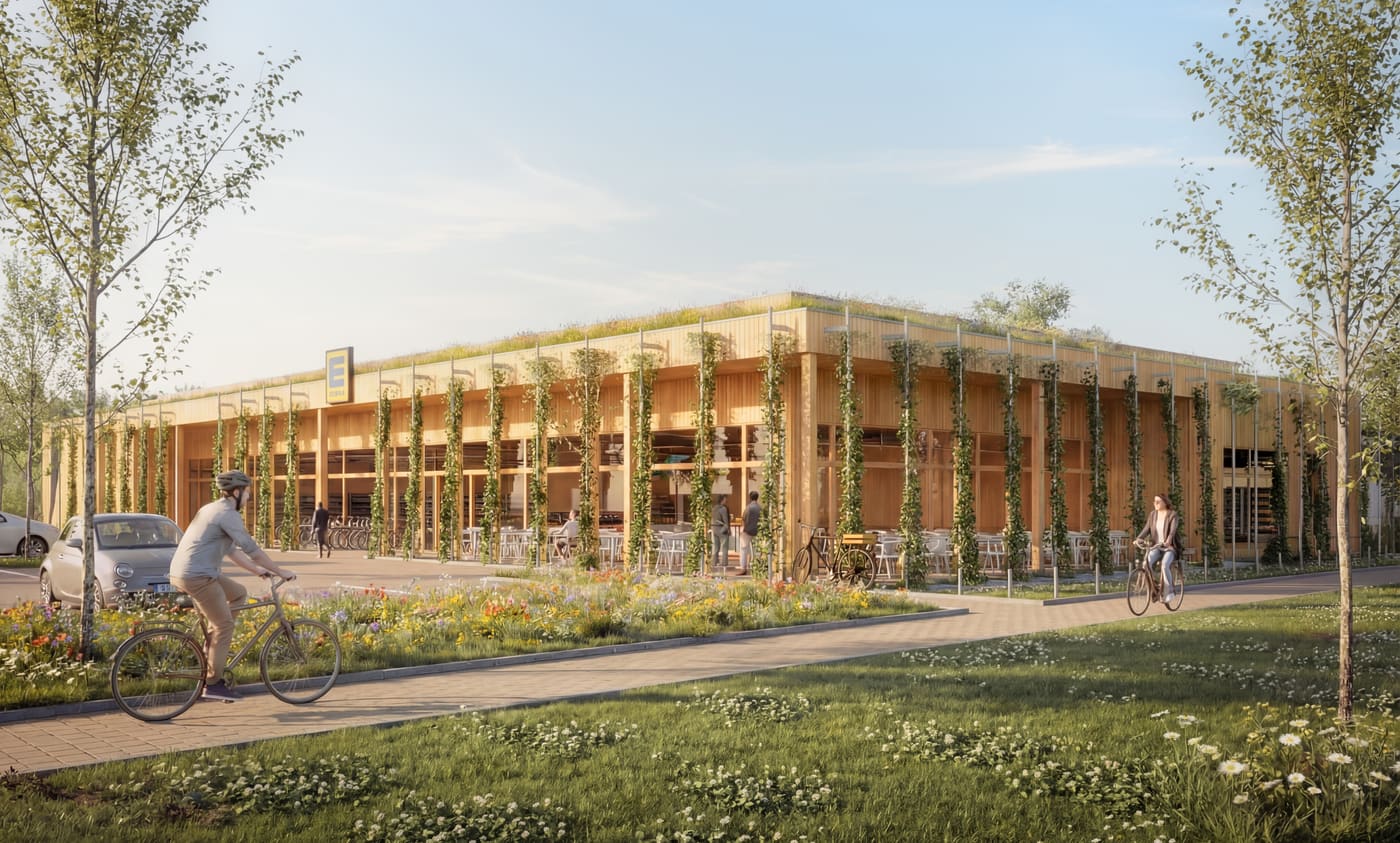 Außenansicht des Marktes mit begrünter Holzfassade und Wildblumenwiese